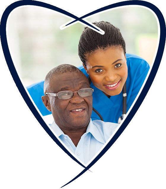 A man and woman in blue scrubs are smiling.